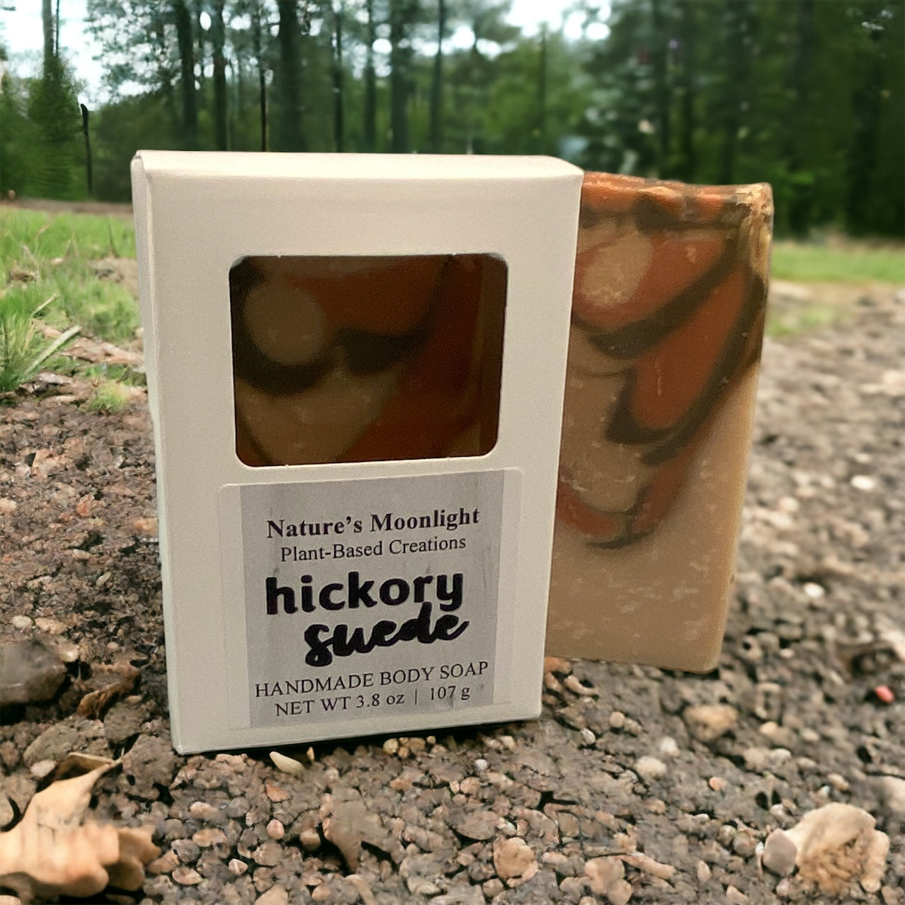 Hickory Suede vegan soap bar with cream base color with swirls of rust and dark green at the top