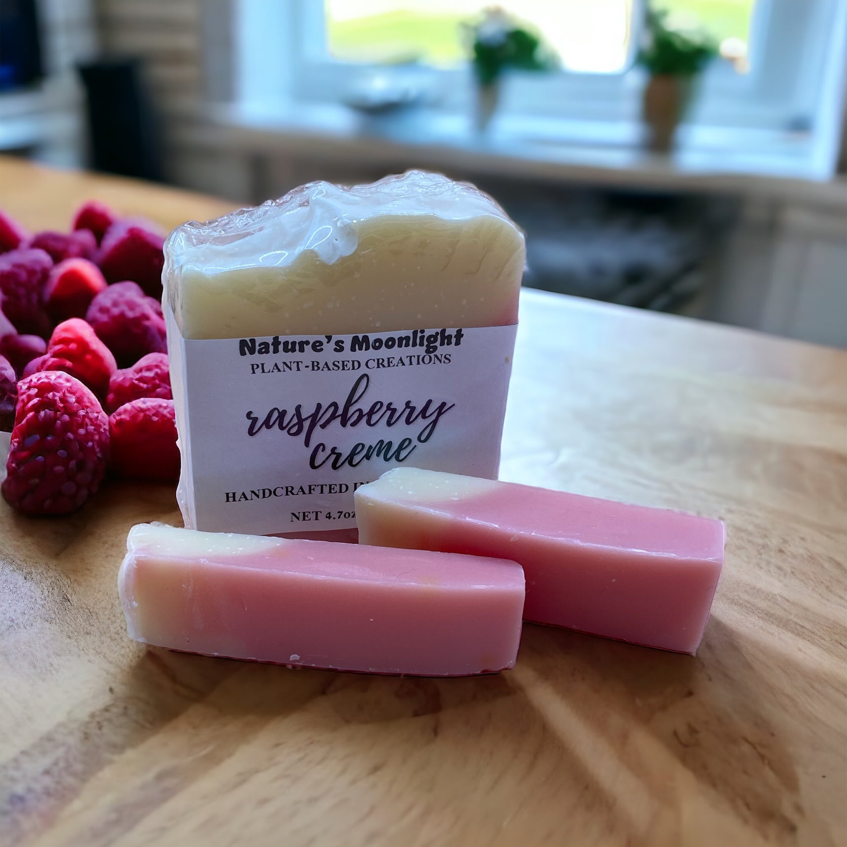 Raspberry Creme vegan bar soap with a raspberry red on the bottom and a cream on the top.